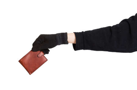 Thief holding a brown leather purse isolated on white backgroundの写真素材