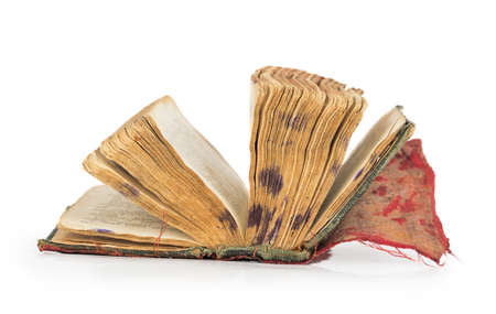 Open old book isolated on white backgroundの写真素材