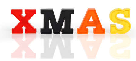 Text "XMAS" of plastic letters isolated on white backgroundの写真素材
