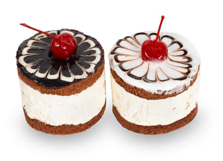 Two chocolate cakes with cherry isolated on white bacground