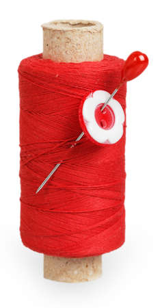 The coil of red thread with the red button on pin isolated on white background