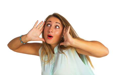 Young woman with a surprised face isolated on white backgroundの写真素材