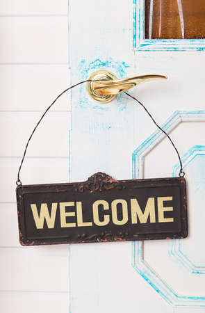 Wooden welcome sign on white doorの写真素材