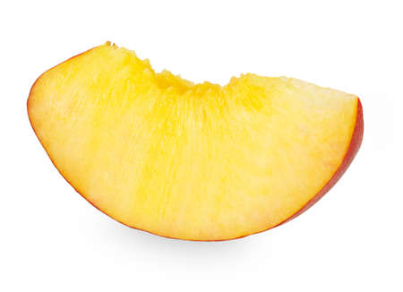 Ripe peach fruit slice isolated on white backgroundの写真素材