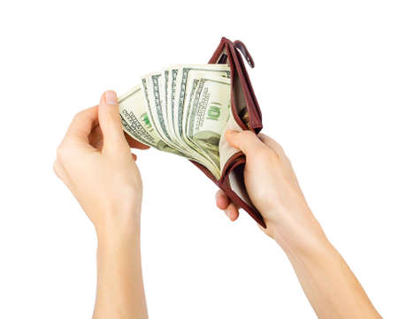 Men's hand gets dollars from a purse isolated on white background
