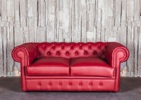 leather sofa on a background of a stone wallの写真素材