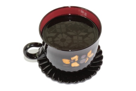 Cup of coffee on saucer on a white backgroundの写真素材