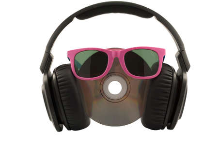 music concept, headphone and cd with sun glasses on white background