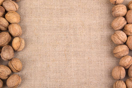 Walnuts on sacking texture bacground  walnut macroの写真素材