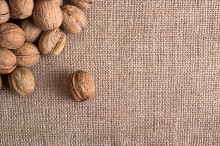 Walnuts on sacking texture bacground  walnut macroの写真素材