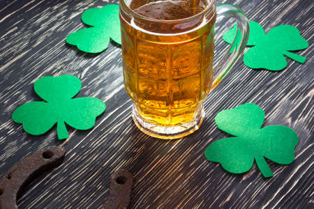 Shamrock clover, horseshoe and beer - symbol of holiday St Patrick's Dayの写真素材