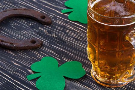 Shamrock clover, horseshoe and beer - symbol of holiday St Patrick's Dayの写真素材