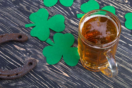 Shamrock clover, horseshoe and beer - symbol of holiday St Patrick's Dayの写真素材