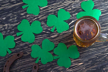 Shamrock clover, horseshoe and beer - symbol of holiday St Patrick's Dayの写真素材