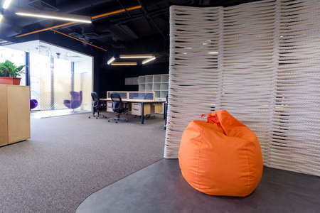 Modern office interior with tables and chairs.の写真素材