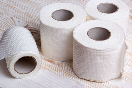 Rolls of toilet paper on wooden boardの写真素材