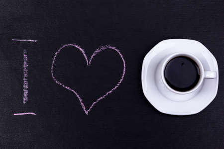 coffee ground with i love text and cup of coffee on black backgroundの写真素材