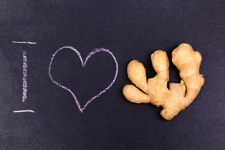 Ground with i love text and ginger on the black background.の写真素材