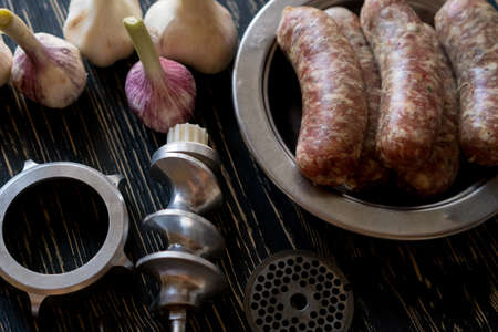 raw sausages , garlic and old meat grinder partsの写真素材
