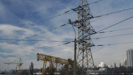 Part of the crane and electricity pylon.