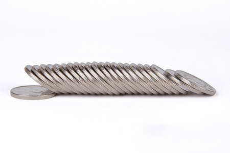 Coins of white metal lie in a row on a white background. Numismatic collection. Coins of Ukraine.