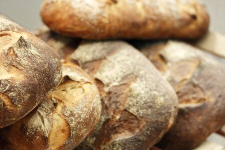 Close up of fresh baked rustic bread. Shallow focus.の写真素材