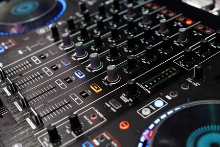 Closeup of the top panel of standalone DJ player and DJ mixer controller. Selective focus.の写真素材