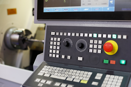 CNC lathe machine with a control panel. Selective focus.の写真素材