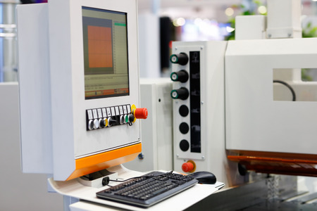 CNC control console of industrial woodworking equipment. Selective focus.の写真素材