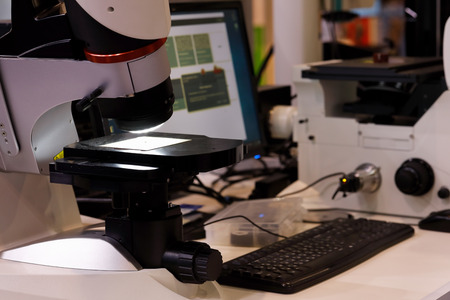 Quality control laboratory with the microscope on the foreground. Selective focus.の写真素材