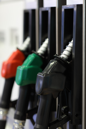 Pistol fuel dispenser at a gas station. Selective focus.の写真素材