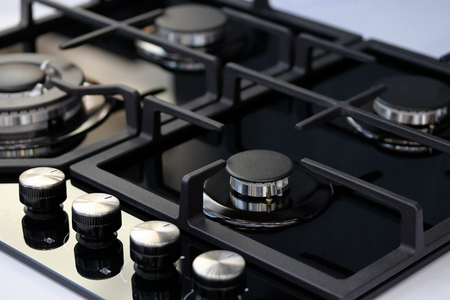 Modern auto ignition gas stove with four burners. Selective focus.の写真素材