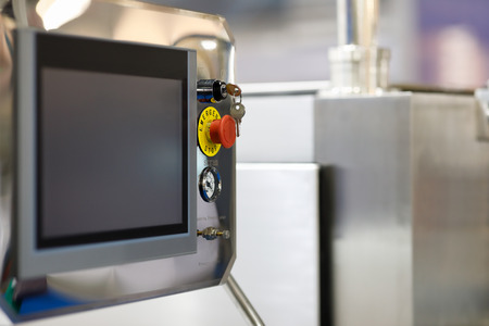 Touchscreen control panel of manufacture equipment. Selective focus.