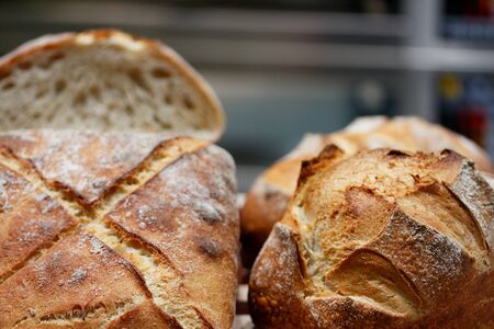 Bread loaves in an artisan bakery. Selective focus.の写真素材