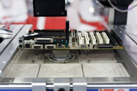 Computer motherboard repair machine with the large heating zone. Selective focus.