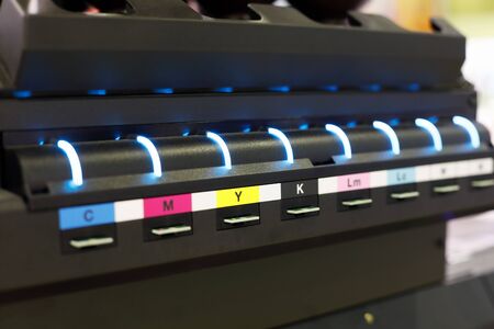 Ink supply unit of large format flatbed inkjet printer. Selective focus.