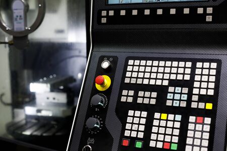 Control panel of multi-axis CNC machine. Selective focus.