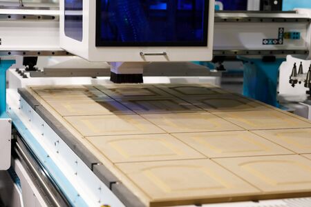Engraving of MDF facades on a CNC milling machine. Selective focus.の写真素材