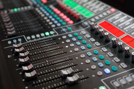 Professional audio studio sound mixer console. Selective focus.の写真素材