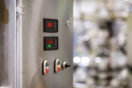 Stainless steel control cabinet of industrial equipment. Selective focus.