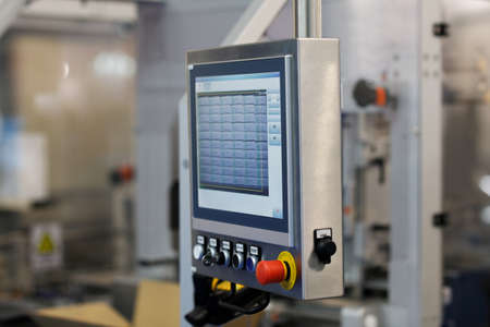 Control panel of testing equipment on a factory production line. Selective focus.