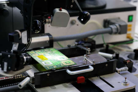 Professional printed circuit boards repair machine. Selective focus.