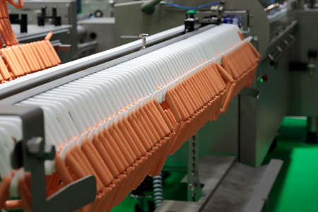 Automatic sausage production line and sausage hanging system in meat processing plant. Selective...