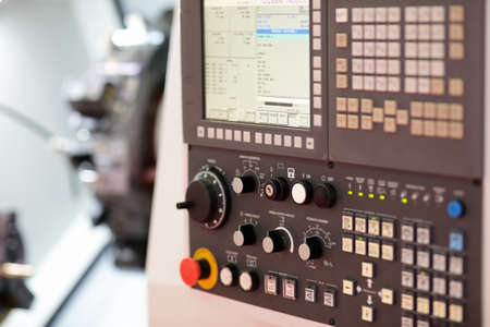 CNC control panel of turret lathe machine. Selective focus.の写真素材