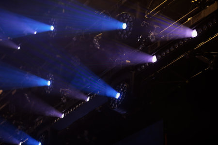LED lighting fixtures hanging over concert stage. Selective focus.