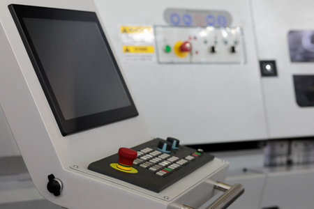 CNC control console of modern industrial equipment. Selective focus.