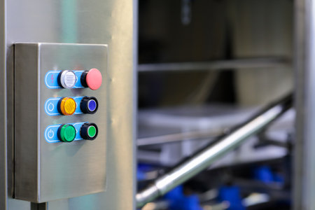Control box of automated machine at food processing factory. Selective focus.