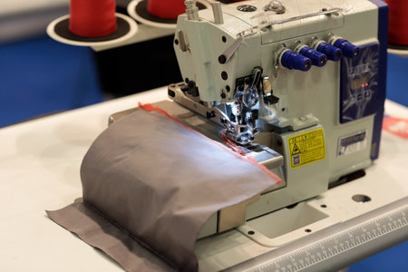 High speed four thread industrial overlock. Selective focus.