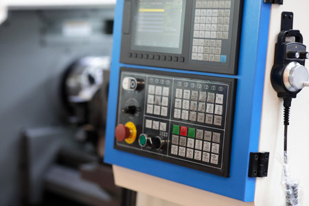 CNC control panel of industrial metalworking turning machine. Selective focus.