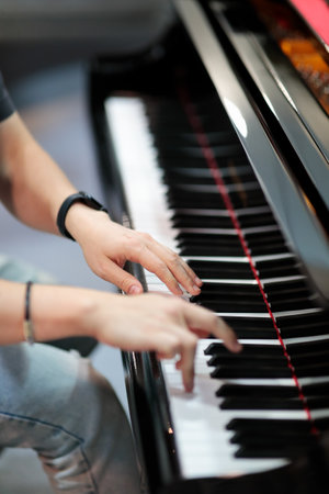 Close-up of a musician playing the piano. Piano player closeup. Selective focus.の写真素材